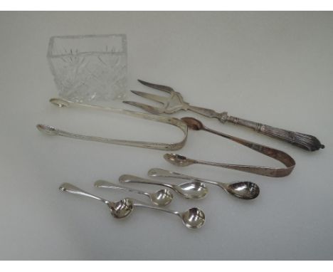A selection of HM silver including a pair of Georgian sugar nips, silver handled pickle fork, salt and mustard spoons