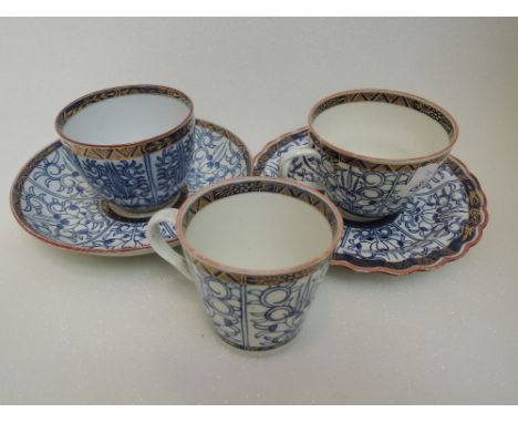 Five pieces of late 18th century Worcester, including tea cups and saucers in blue and white lily style pattern