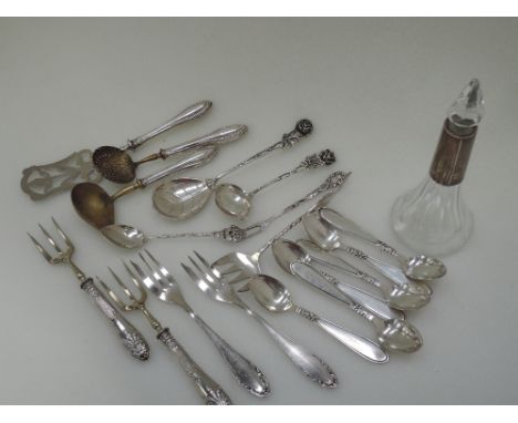 A small selection of white metal flatware many pieces stamped 800, including a small German sauce ladle and spoon with termin