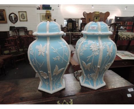 A pair of modern ceramic table lamps designed as blue and white oriental bases