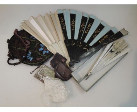 A selection of vintage haberdashery including beaded evening bag, fans, leather coin purses, beads etc
