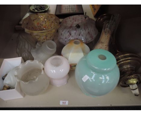 A vintage brass column oil lamp and a selection of shades including 1920's mottled ceiling pendant 
