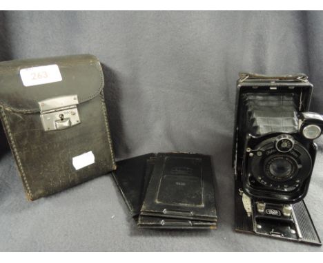 A Zeiss Ikon Derval folding camera with Anastigmat lens, with leather case and plates