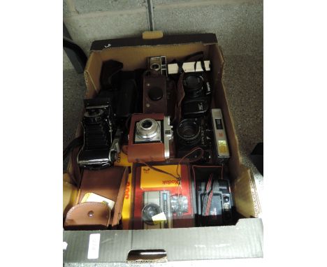 A box of 35mm, folding and instamatic cameras, including Coronet Rapide, a Zenet TTL, an Agfa Isola, a Tashima FMD, a Purma s