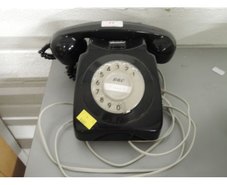 A vintage GEC black plastic telephone no. 746 GEN 80/1A