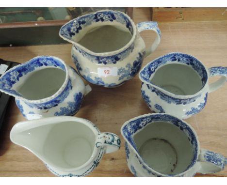 A selection of vintage ceramics including blue and white Delft ware style jugs