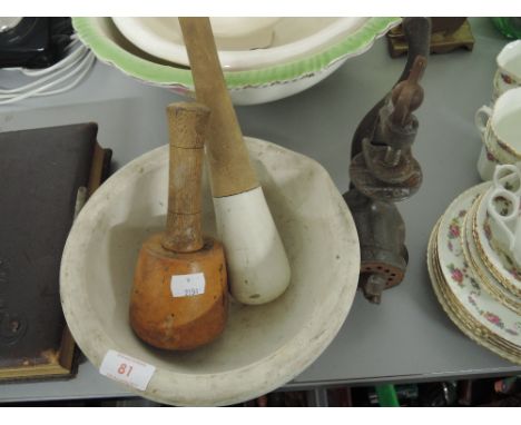 A vintage large ceramic morter and pestle set also includes carvers mallet and cast mincer