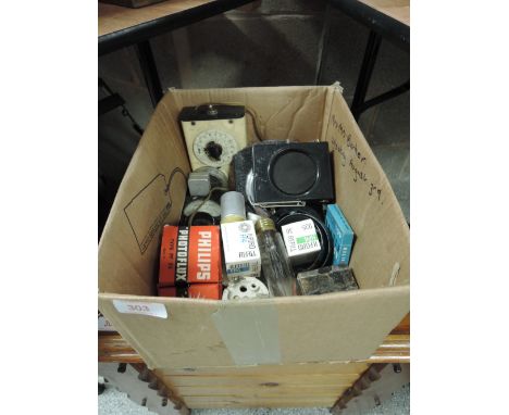 A box of various photographic equipment, filters, light meters etc
