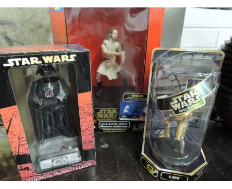 A star Wars talking alarm clock as Darth Vader 1997 Lucasfilm, Qui Gon Jinn Talking Bank and C 3po rotating figure