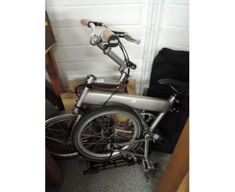 A folding bicycle by Mezzo with pannier and stand, a well built nice and light with a good design