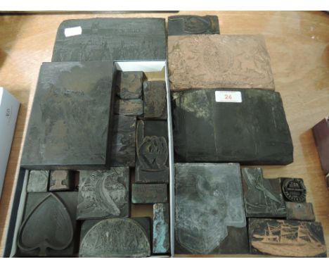 A selection of vintage and antique printer blocks some hand carved treen and some copper plated