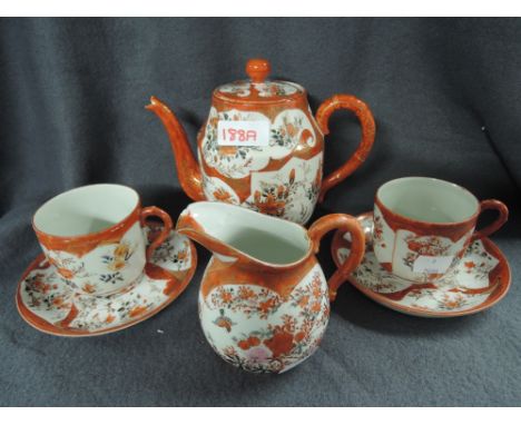 A vintage ceramic tea service in Imari style pattern with hand painted decoration