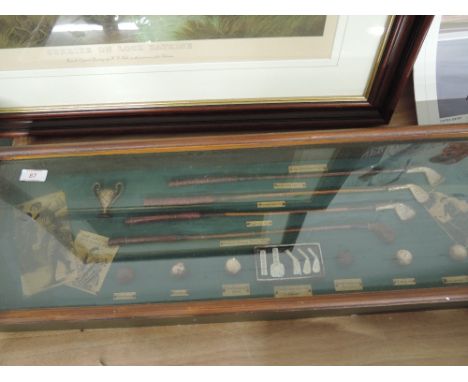 A treen display case housing vintage style miniature golf accessories 