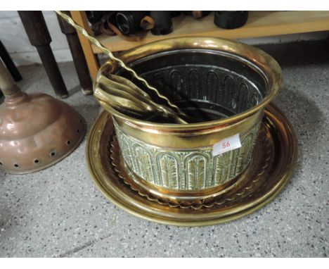 A selection of vintage brass trays and fireside items coal tongues etc
