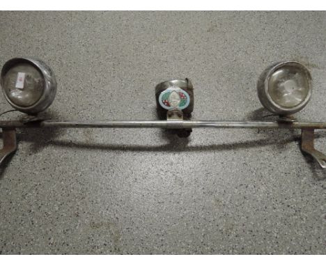 A vintage car light bar with Lucas chrome lights and Westmorland motor club enamel badge also Miller cycle lamp 