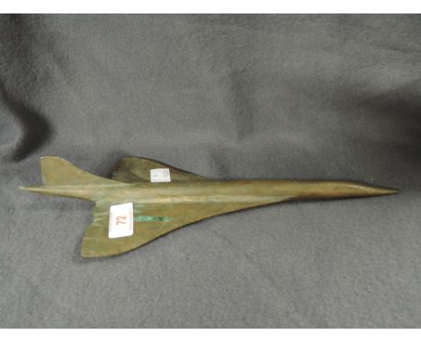 A vintage brass cast desk top model in the form of concord or similar plane