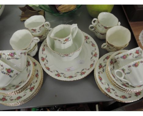 A vintage part tea dinner coffee service with enamel floral print cups jug saucers etc