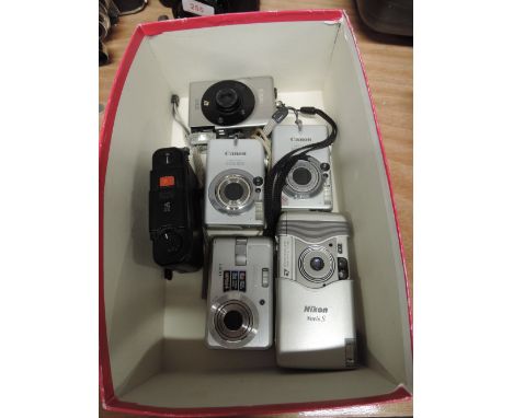 A selection of instamatic and digital cameras including three Canon Ixus 500, Samsung, Nikon and Olympus