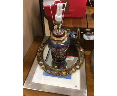 A mirror, a lamp and a print