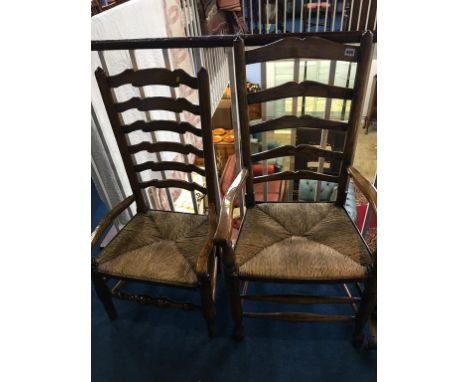 Two oak ladder back chairs