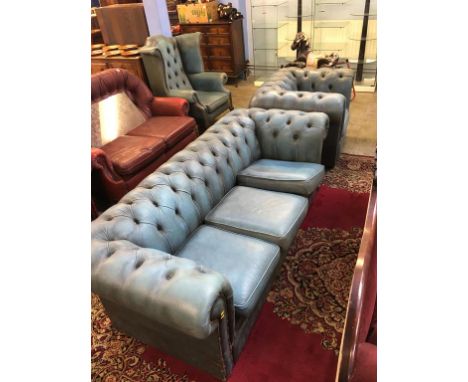 A Chesterfield blue leather three seater settee and club armchair