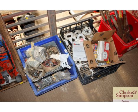 Two boxes containing various nuts and bolts and light bulbs etc.