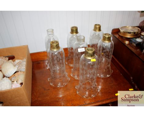 Seven etched glass light shades