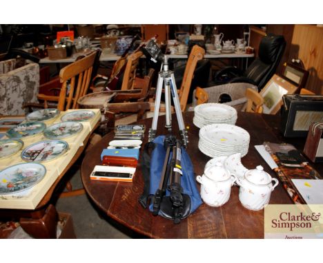 Two camera tripods, one with carry bag