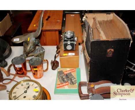 A Carl Zeiss Rolleiflex camera with relating book and wooden case