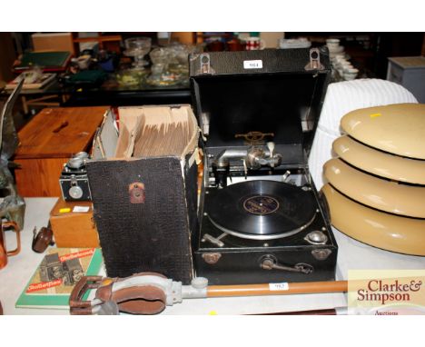 A Columbia record player together quantity of records