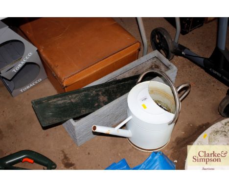 A planter and watering can