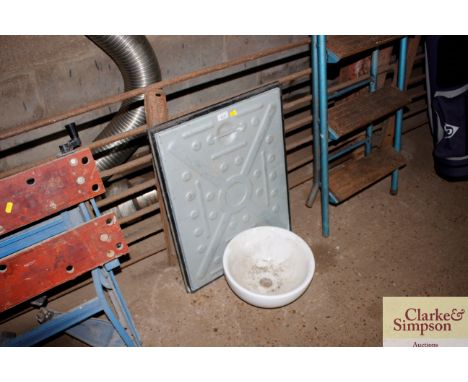 An as new metal drainage cover with surround; and a circular white basin 