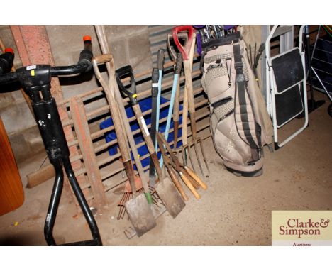 A small quantity of long handled tools including shears, border forks, rakes, small spades etc.