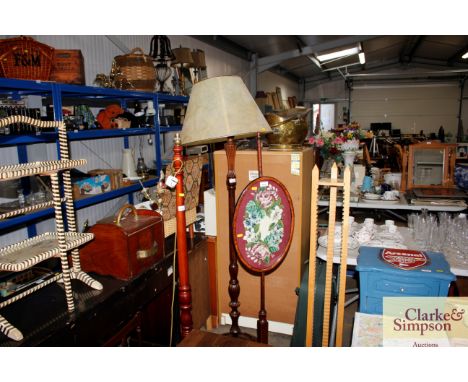 A mahogany standard lamp and shade