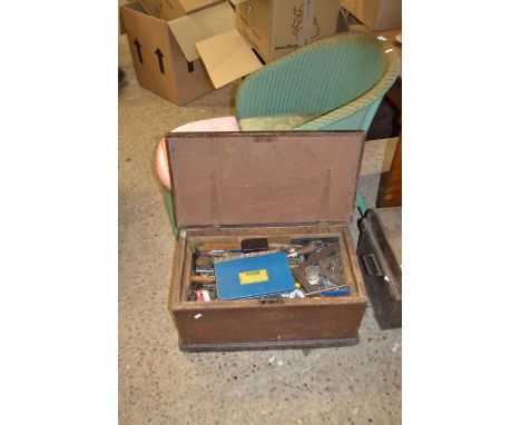 Wooden tool chest containing an extensive range of various hand tools