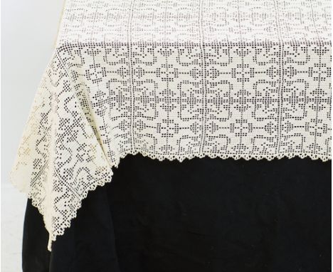 An old hand crocheted tablecloth, beige with squares and geometric pattern measuring 180x160cm. With minor stains. Mid 20th c