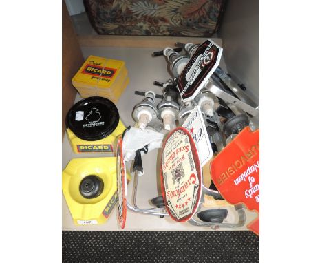 A selection of vintage pub taps and advertising items