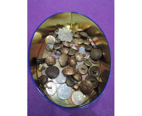 A selection of vintage military buttons and similar