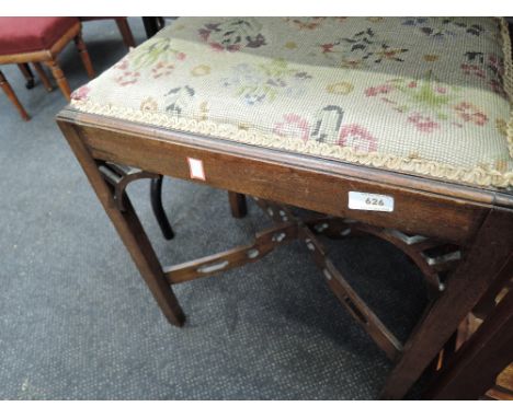 A 19th century mahogany stool having later tapestry top, on square fret legs