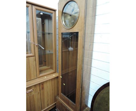 An 1930s walnut cased longcase clock, brass face named Haller