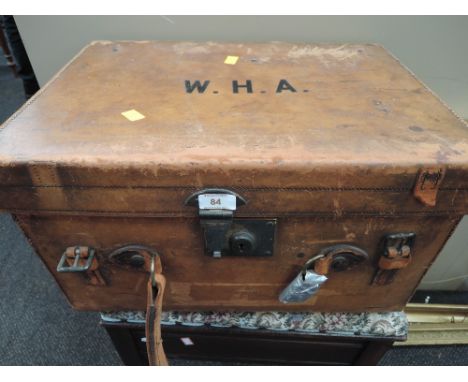 A vintage travel trunk case marked W.H.A to top
