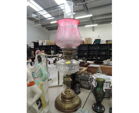 A vintage oil burning lamp with cranberry etched shade and glass well10CM ACROSSNO VISIBLE FAULTS OR REPAIR