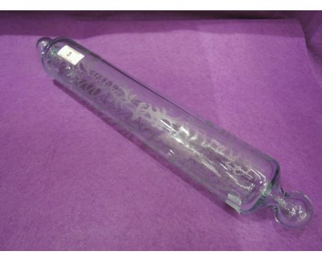 A traditional glass rolling pin having fern etched decoration