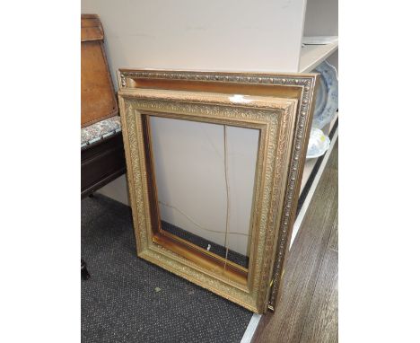 Two vintage gilt and plaster effect picture frames