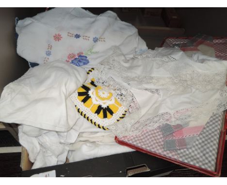 A selection of vintage and antique table linen,including tray cloths,pillow slip, and some intricately embroidered pieces.als