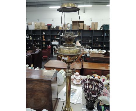 An Edwardian brassed oil lamp frame of reeded pillar design