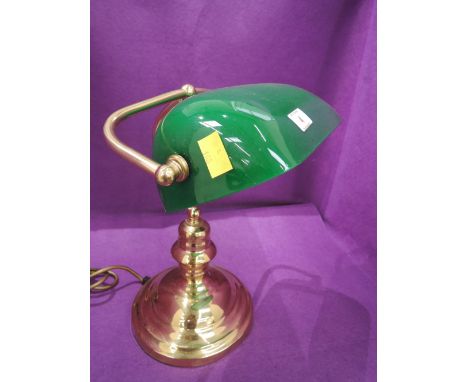 A vintage desktop office lamp brass with green glass shade