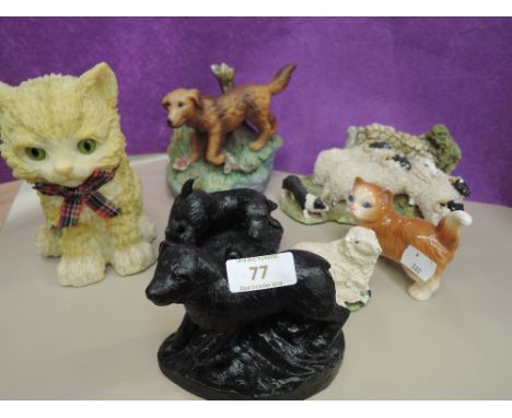 A selection of vintage figures and figurines including green kitten