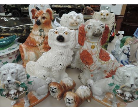 A selection of vintage Staffordshire flatback figures mostly dog related