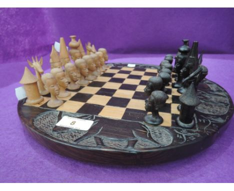 A vintage hand carved African theme chess set 